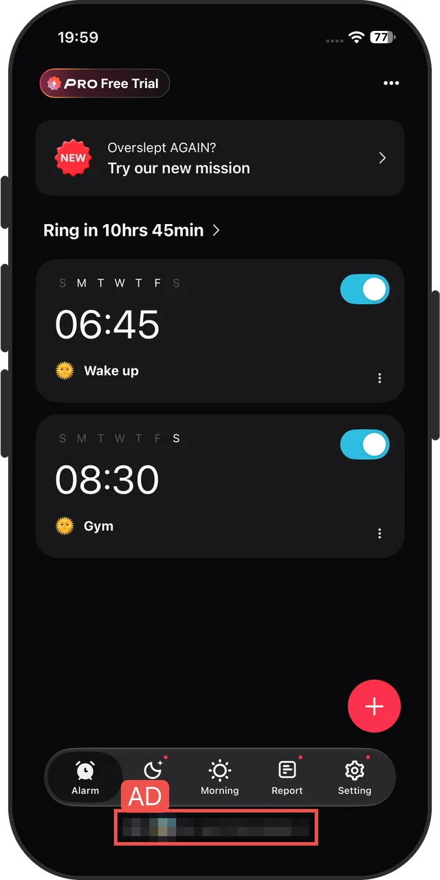 Alarmy's alarm list, with a banner ad at the bottom (ad pixelated by us)